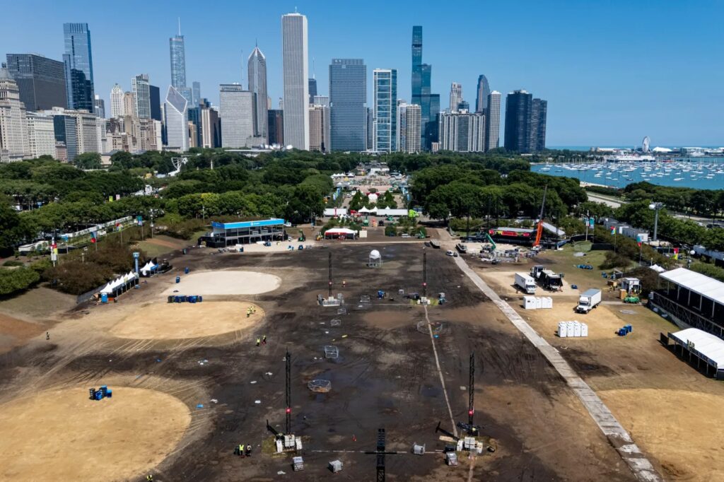 Workers pack up Lollapalooza stages and tents in muddy Hutchinson Field area at the south end of Chicago’s Grant Park on Aug. 3, 2026. (Brian Cassella/Chicago Tribune)