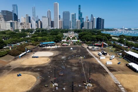 Workers pack up Lollapalooza stages and tents in muddy Hutchinson Field area at the south end of Chicago’s Grant Park on Aug. 3, 2026. (Brian Cassella/Chicago Tribune)