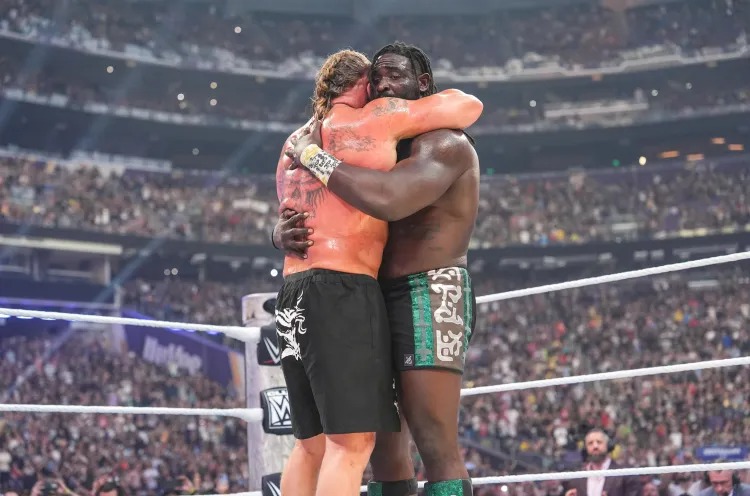 MINNEAPOLIS, MINNESOTA - AUGUST 1: Brock Lesnar and Oba Femi hug in ring during SummerSlam at U.S. Bank Stadium on August 1, 2026 in Minneapolis, Minnesota. (Photo by Georgiana Dallas/WWE via Getty Images) WWE via Getty Images