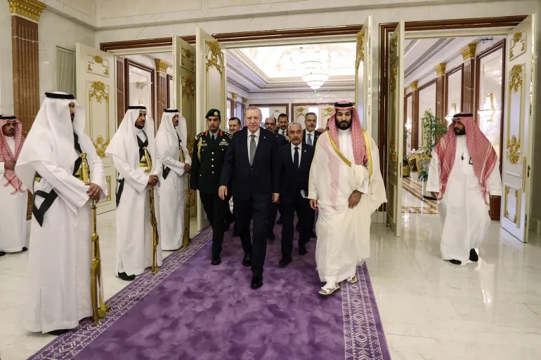 Saudi Arabia's Crown Prince Mohammed bin Salman walks alongside Turkish President Recep Tayyip Erdogan during their meeting in Mecca on August 7 [Handout via AFP] By Brian Osgood