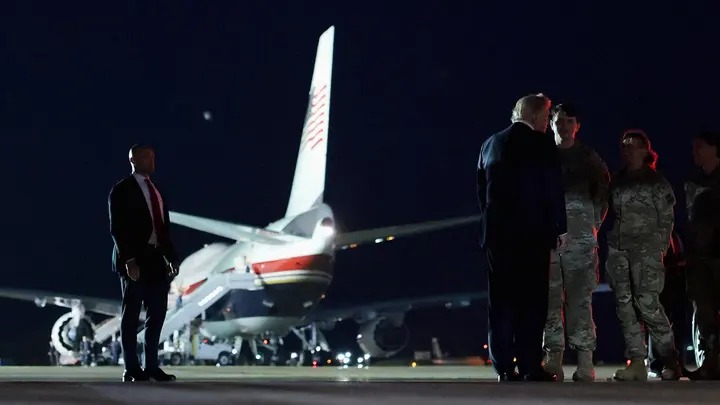 President Donald Trump greets security forces members at RAF Mildenhall in Suffolk, Britain, after arriving to switch to the Qatari-gifted Air Force One following his participation in a NATO leaders summit in Turkey, July 8, 2026. (Jonathan Ernst/Reuters)