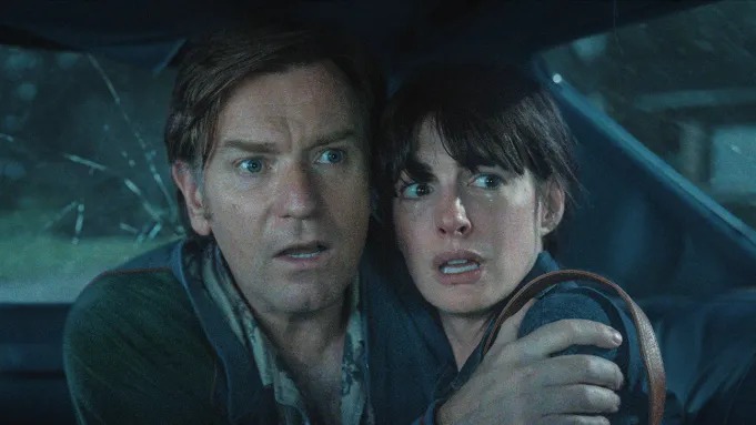 Ewan McGregor (left) and Anne Hathaway in 'The End of Oak Street.' Courtesy Warner Bros. Pictures
