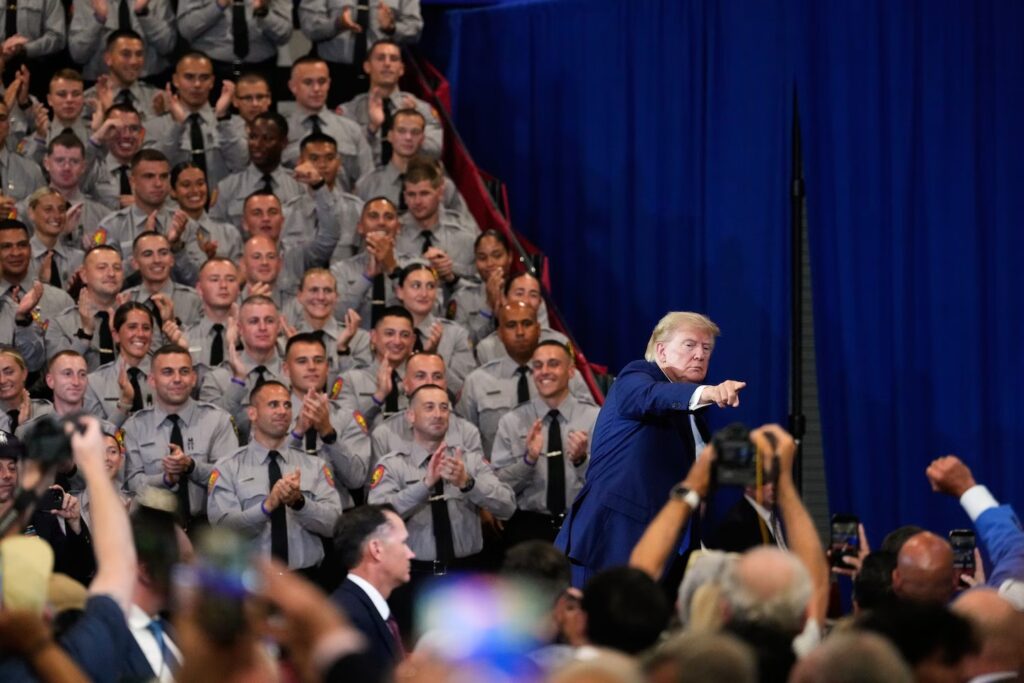 President Donald Trump leaves the stage after speaking in Garden City, New York. (Yuki Iwamura/AP)