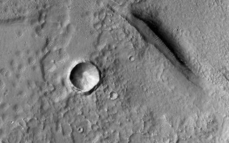 NASA Mars Reconnaissance Orbiter view of bumpy and pitted terrain elsewhere in Utopia Planitia. Regional context image, not the Zhurong gypsum outcrop. Credit: NASA/JPL-Caltech/University of Arizona. Public domain. Source.