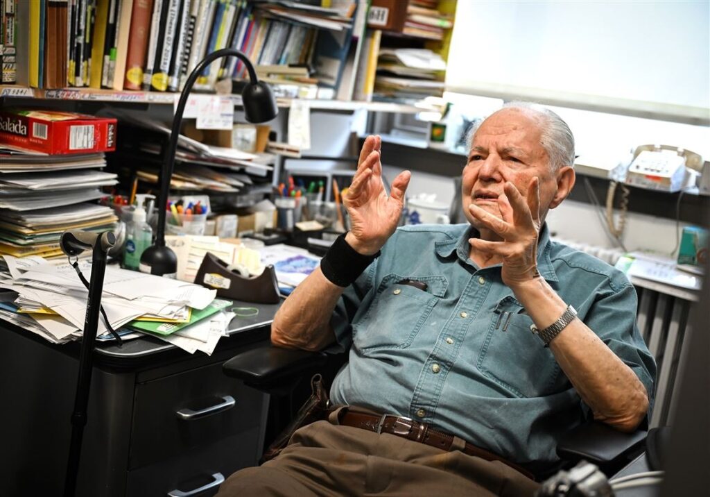 Wolfgang Justus "Jim" Choyke, a 100-year-old professor emeritus in the physics and astronomy department at the University of Pittsburgh, talks about his life in his office, Thursday, July 30, 2026, in Oakland. (Alexandra Wimley/Post-Gazette)