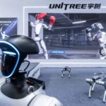 A Unitree Robotics G1 humanoid robot and Unitree Robotics As2 robot dogs on display at the Embodied Intelligent Robot Industry Exhibition in Shanghai on Aug. 12.Qilai Shen / Bloomberg via Getty Images