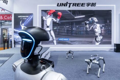 A Unitree Robotics G1 humanoid robot and Unitree Robotics As2 robot dogs on display at the Embodied Intelligent Robot Industry Exhibition in Shanghai on Aug. 12.Qilai Shen / Bloomberg via Getty Images